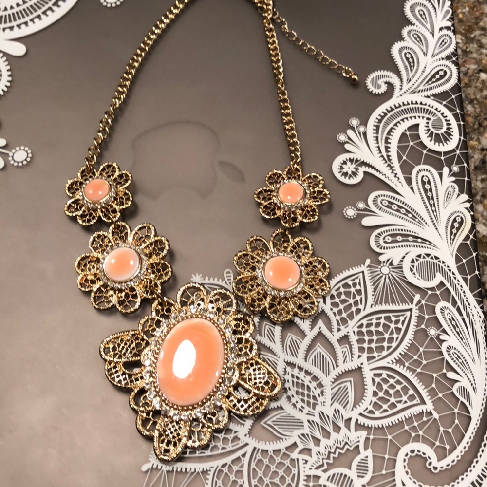 Filigree coral and gold necklace.